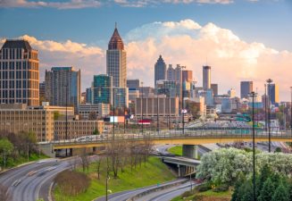 Atlanta, Georgia, USA downtown city skyline over highways at dusk.